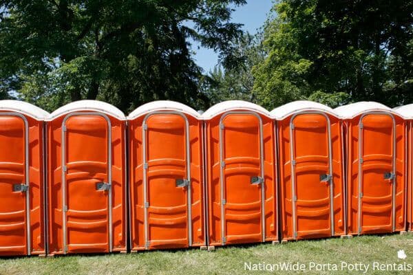 a lineup of clean and well-maintained portable loos for workers in Nebraska